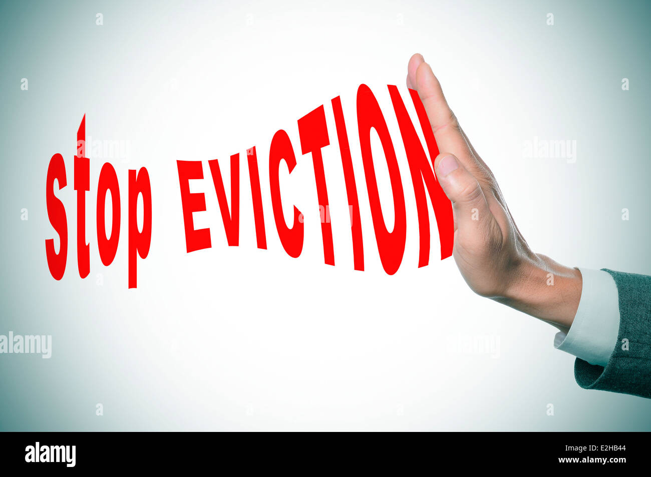 man hand stopping the text stop eviction Stock Photo