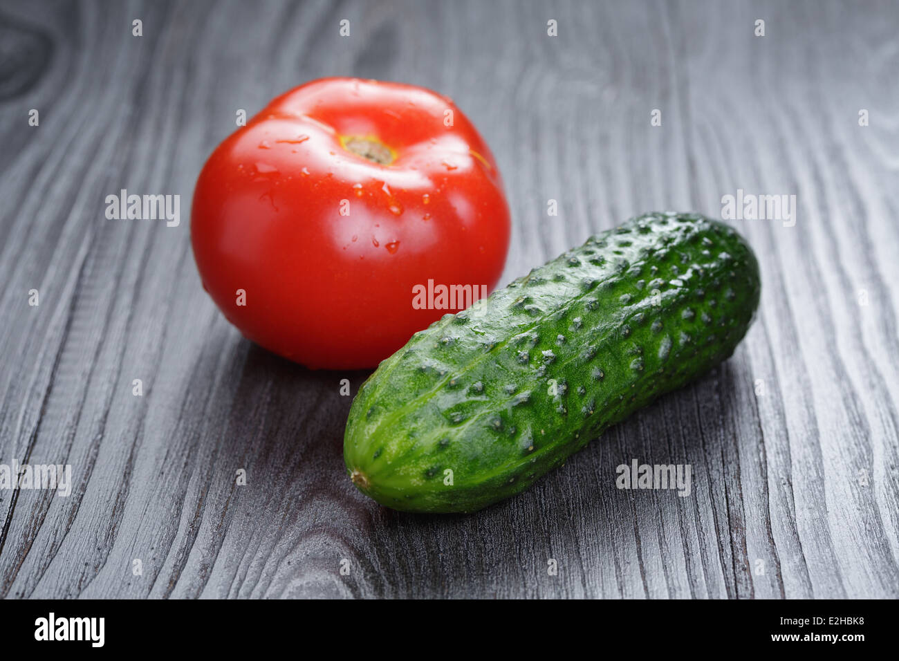 tomato and cucumber on black wood table, closeup photo Stock Photo Alamy