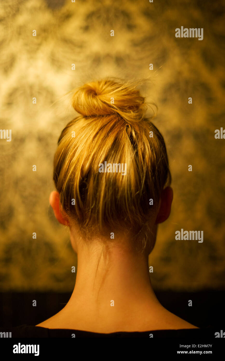 Woman wearing hair in chignon, rear view Stock Photo