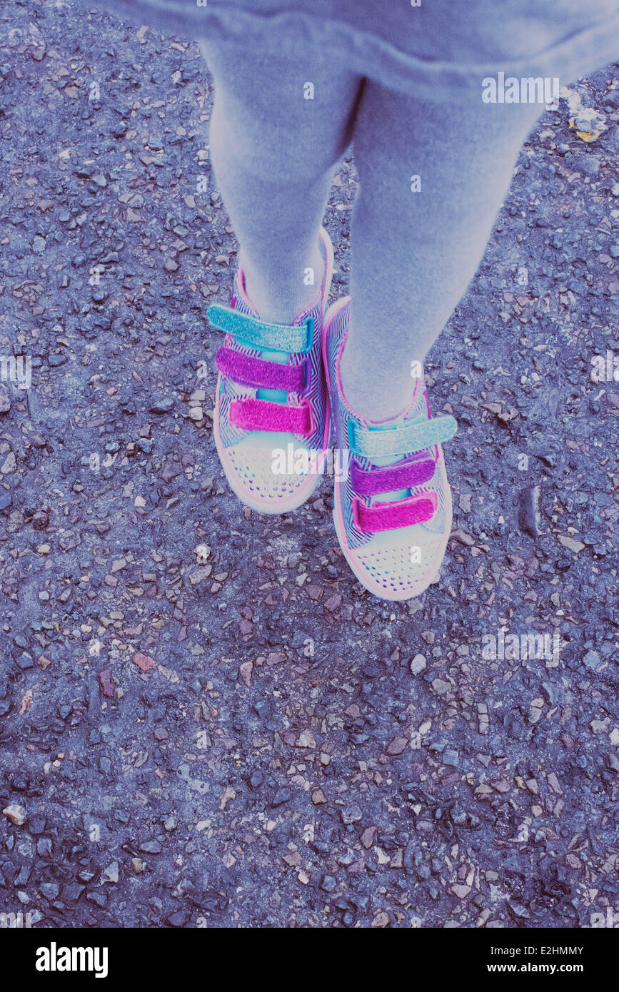 Girl wearing colorful sneakers, low section Stock Photo