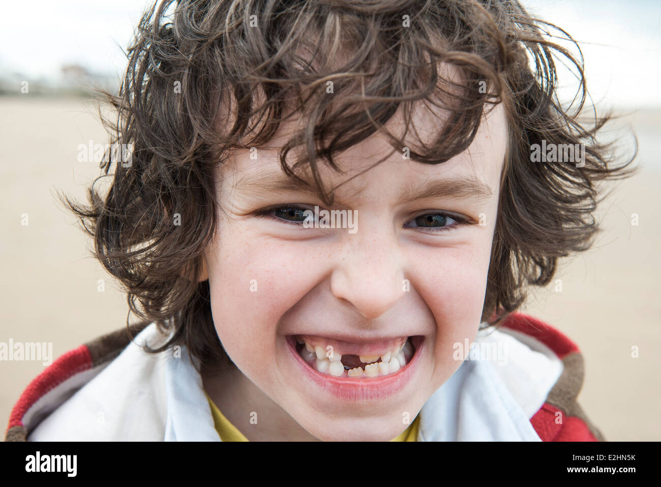 Boy showing off missing tooth, portrait Stock Photo