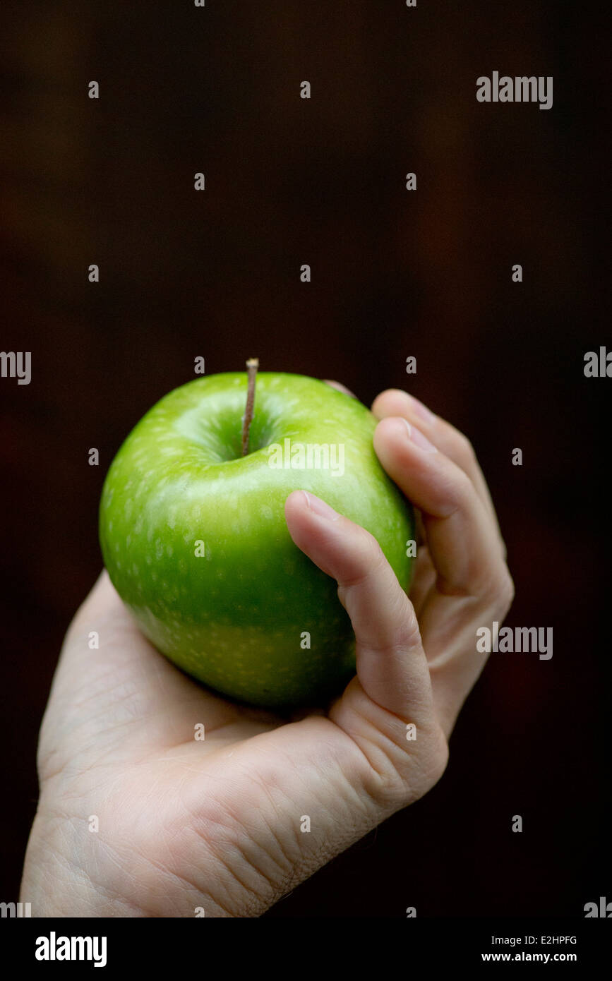 Hand holding apple Stock Photo