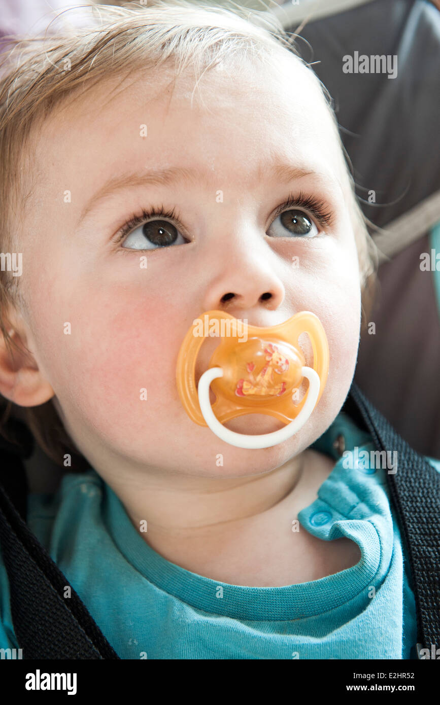 Baby with pacifier in mouth, portrait Stock Photo