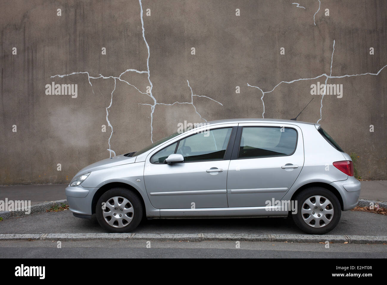 Car parked by curb, Nantes, Loire-Atlantique, France Stock Photo