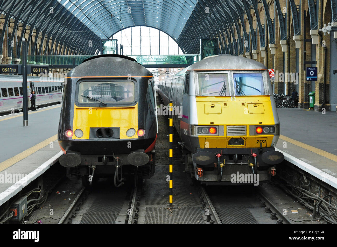 Inter City 125 diesel and 225 electric trains side by side at King's Cross railway station, London, England, UK Stock Photo