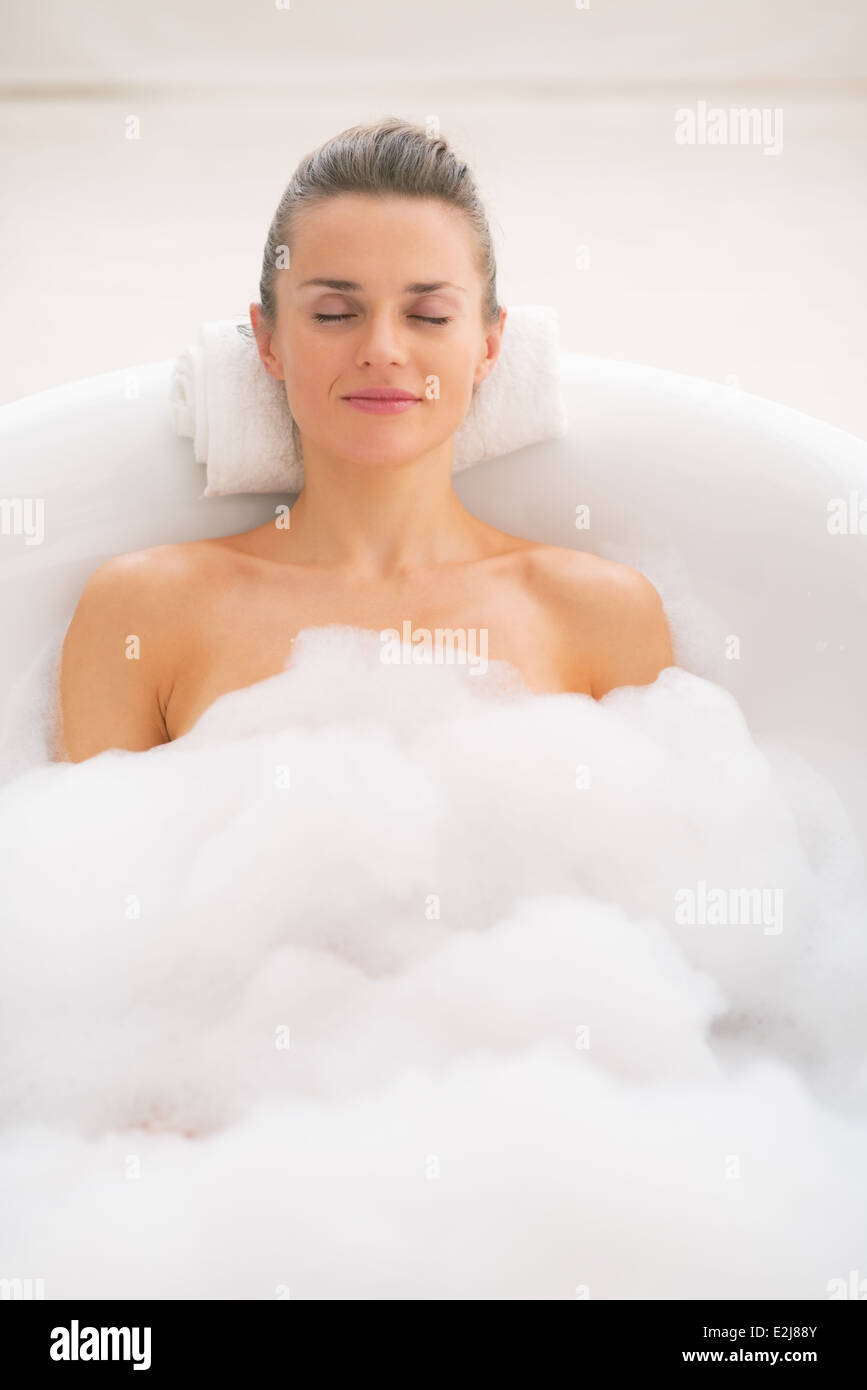Woman, 35, relaxing in a bathtub with rose petals, Thalasso therapy in a  spa resort Stock Photo - Alamy