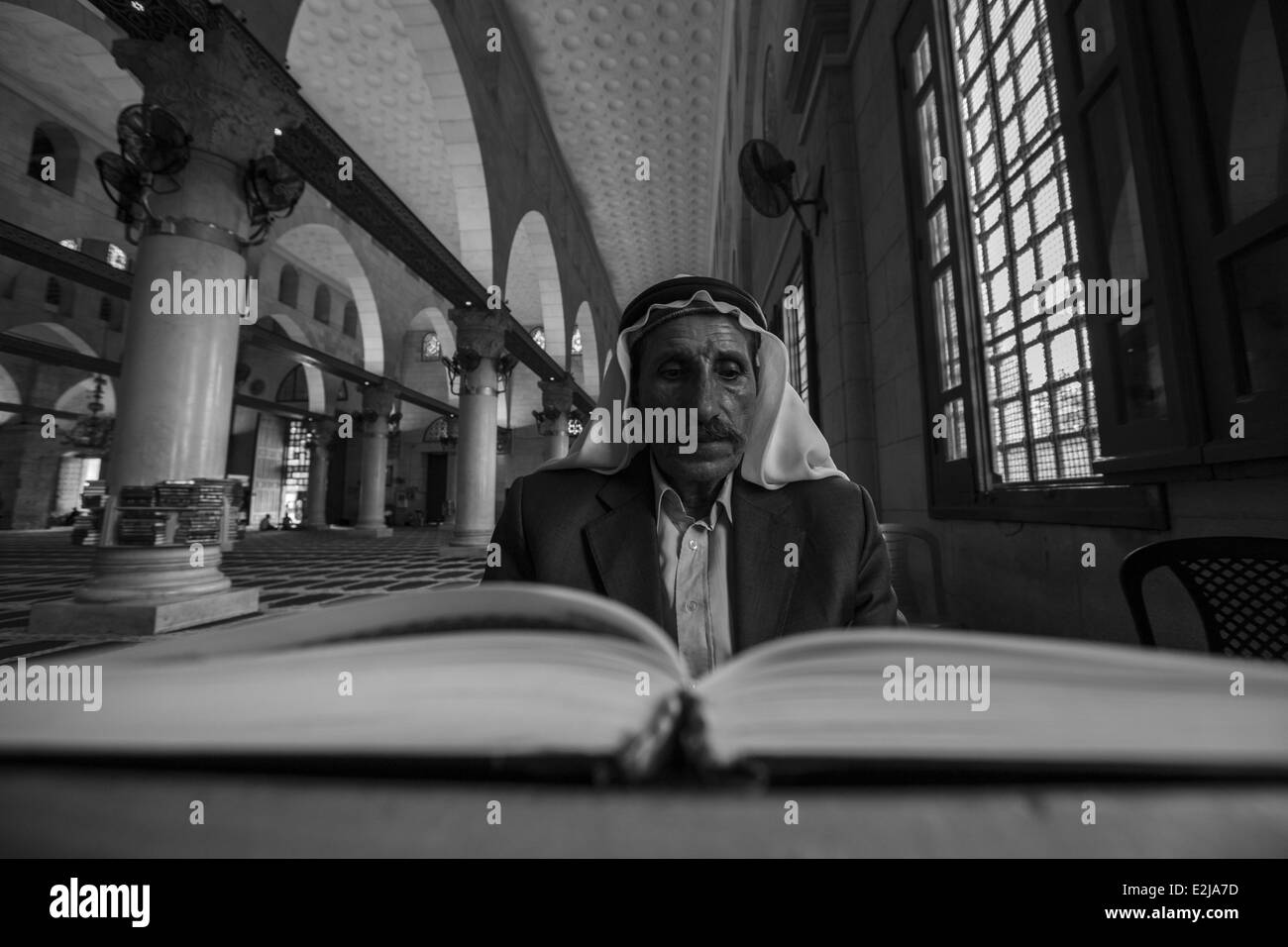 June 19, 2014 - Palestinian Muslim reading the holy book of ''Qur'an'' inside Al-Aqsa mosque in Jerusalem. © Mustafa Bader/ZUMA Wire/ZUMAPRESS.com/Alamy Live News Stock Photo