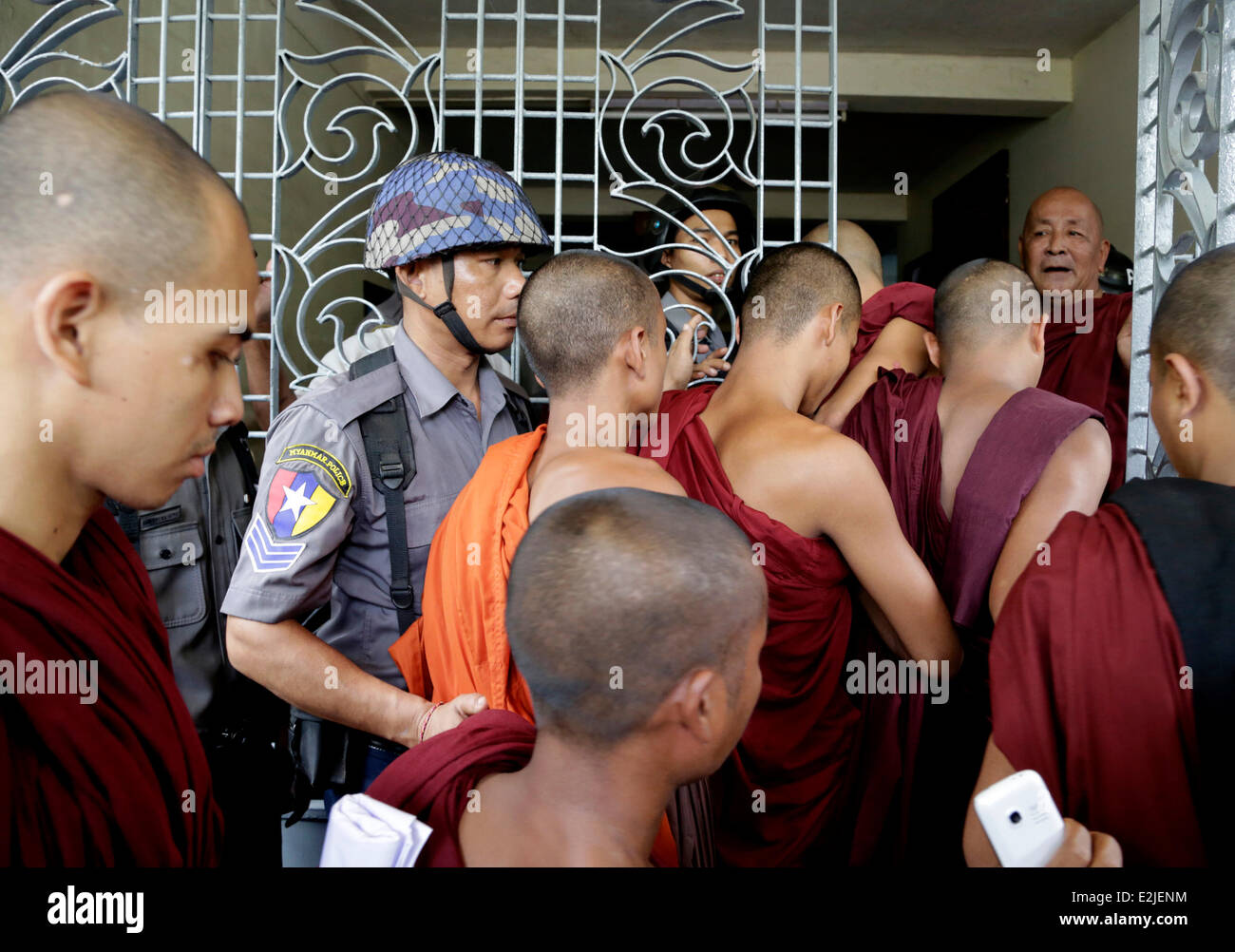 Yangon, Myanmar. 20th June, 2014. Buddhist monks arrive to observe the trial at a court in Yangon, Myanmar, June 20, 2014. Five Myanmar Buddhist monks, who were charged with defaming religion and inciting mutiny against the monastic order, were released on bail Friday. Credit:  U Aung/Xinhua/Alamy Live News Stock Photo