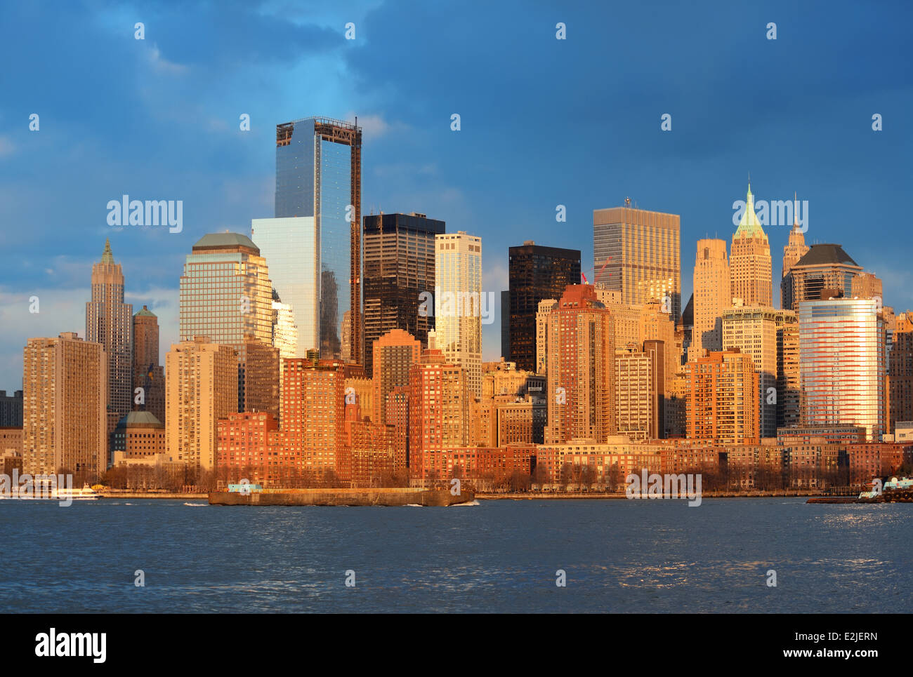 Downtown Manhattan skyline at sunset over Hudson River in New York City ...