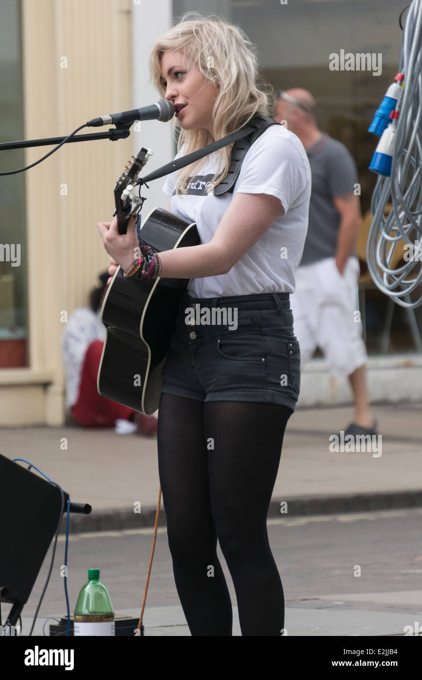Beth McCarthy, contestant on BBC Television's 2014 The Voice, busking in her home town of York. Stock Photo