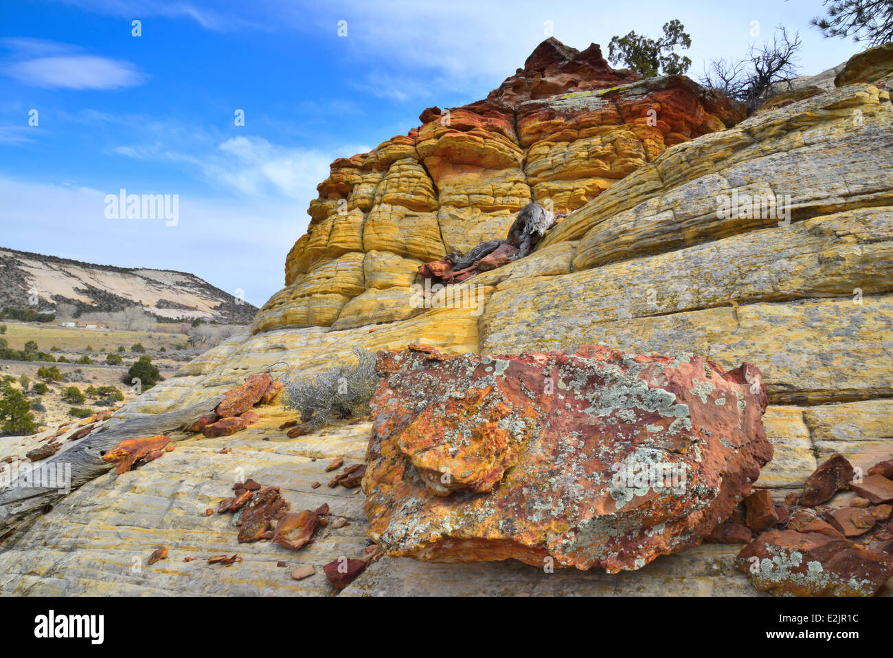 Ancient lichen covered rocks along Boulder-Notom Road in Grand Staircase Escalante National Monument near Boulder, Utah Stock Photo