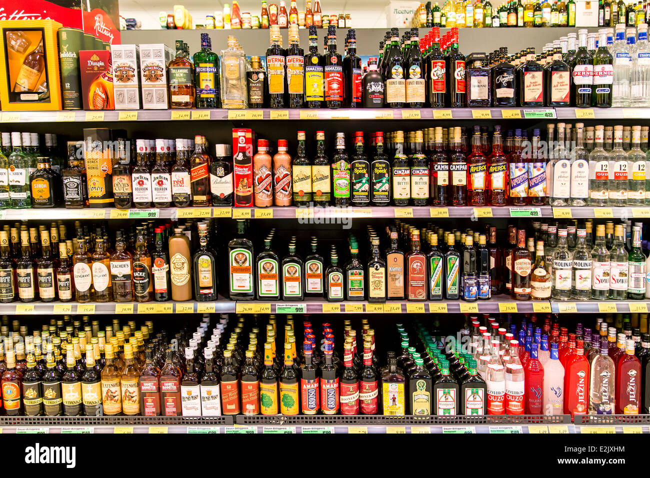 Shelf with food in a supermarket. Liquors, alcohol Stock Photo Alamy