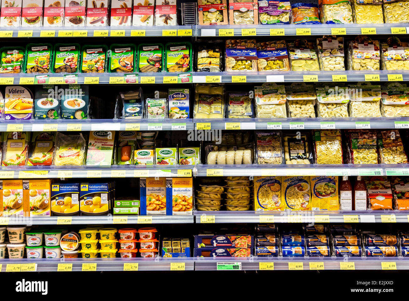 Shelf with food in a supermarket. Refrigerated, ready to eat meals, Pasta products, Stock Photo