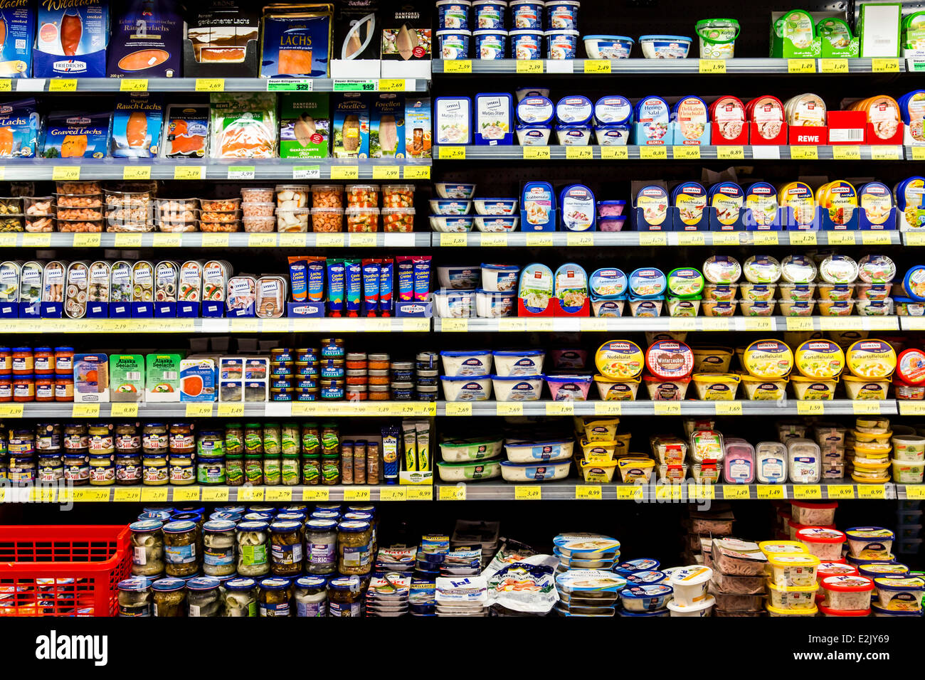 Shelf with food in a supermarket. Feinkost, delicatessen Stock Photo