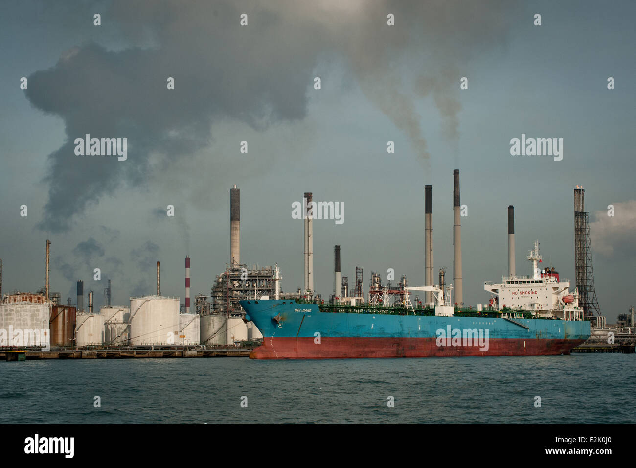 Tanker ready for loading in front of a refinery in Singapore Stock Photo