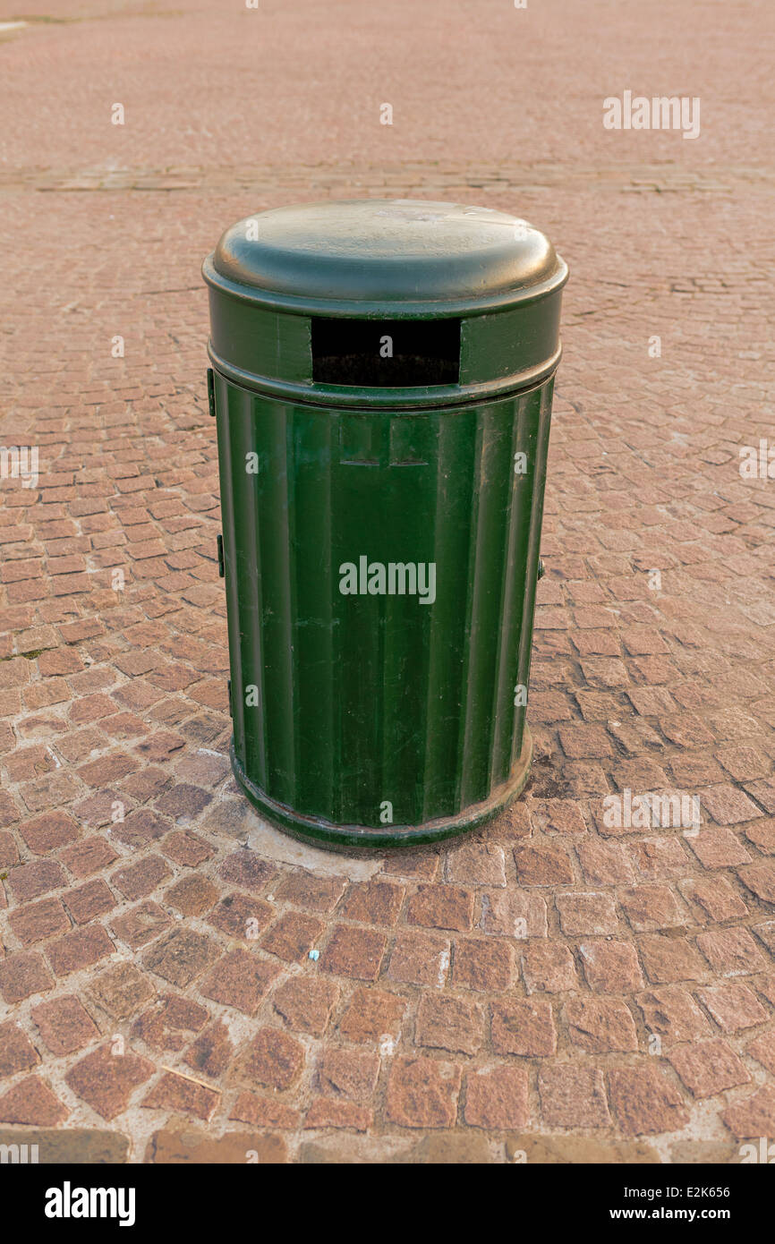 In the center stands a large metal garbage can Stock Photo Alamy