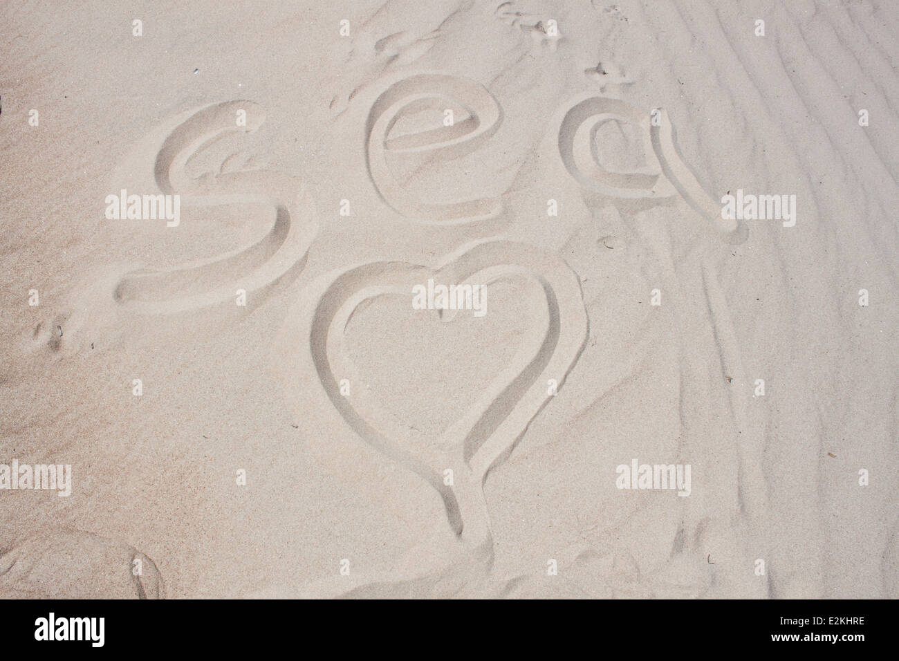 white sand 'sea text' text texture pattern background textured 'heart shape' 'sea word' Stock Photo