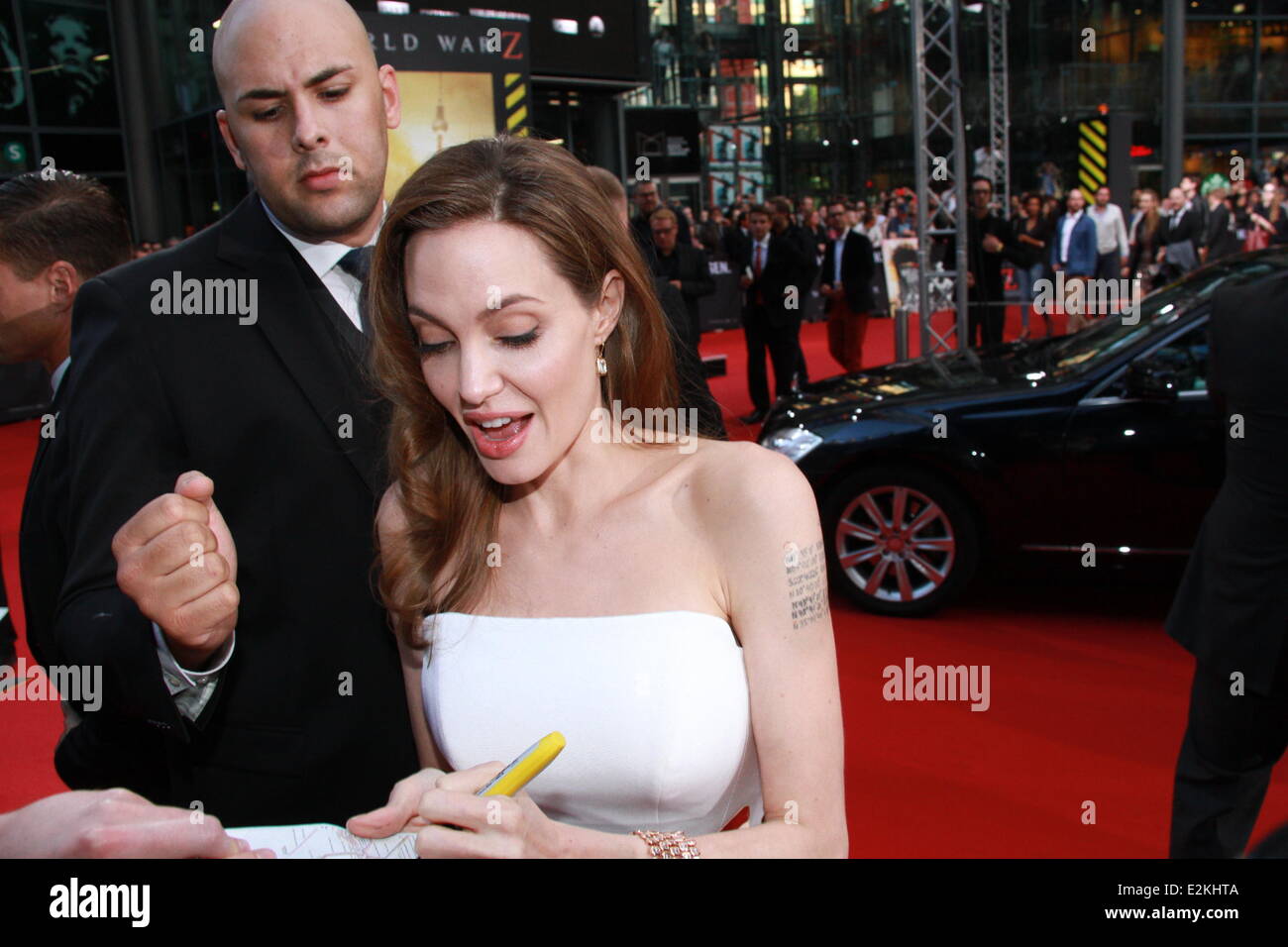 Angelina Jolie signing autographs during World war Z premiere at