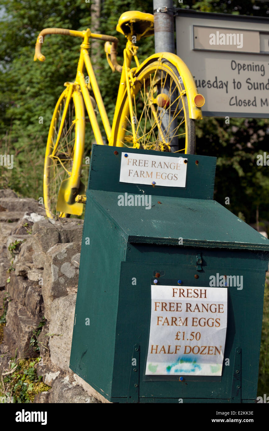 2014 Tour de France, yellow painted bicycles decorate the route in Kilnsey, Yorkshire Dales, UK. The race will start in the county on 5th & 6th July 2014 bringing millions of fans to the Yorkshire roadside to cheer on the champions of the sport.  It will be the first time Le Tour has visited the north of England. Stock Photo