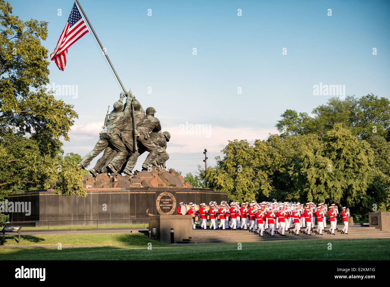The United States Marine Drum and Bugle Corps, known as the Commandant's Own, performs at the Sunset Parade at the Iwo Jima Memorial in Arlington, Virginia, next to Arlington National Cemetery. Stock Photo