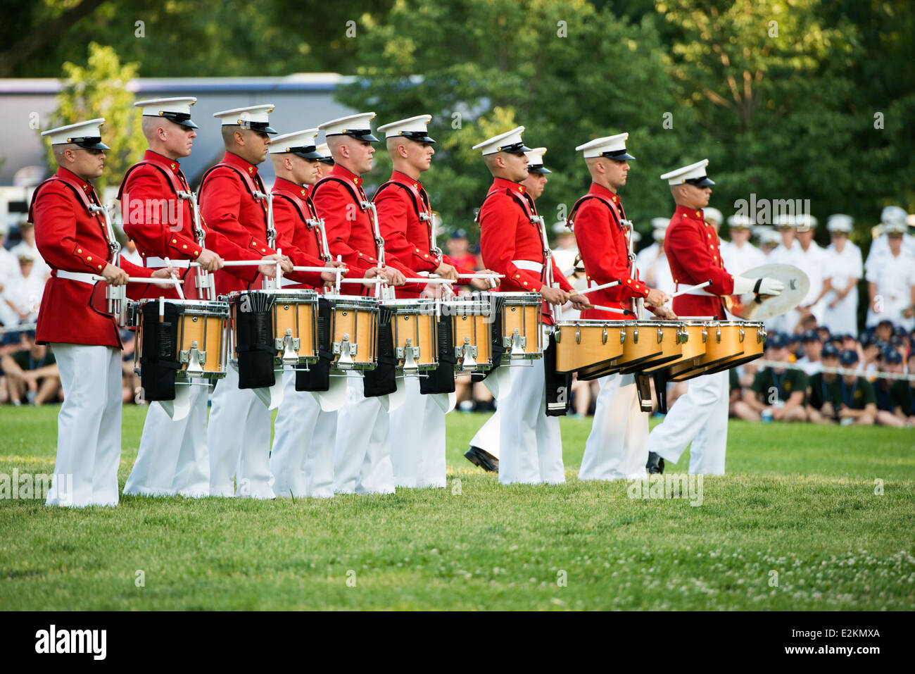 The United States Marine Drum and Bugle Corps, known as the Commandant's Own, performs at the Sunset Parade at the Iwo Jima Memorial in Arlington, Virginia, next to Arlington National Cemetery. Stock Photo