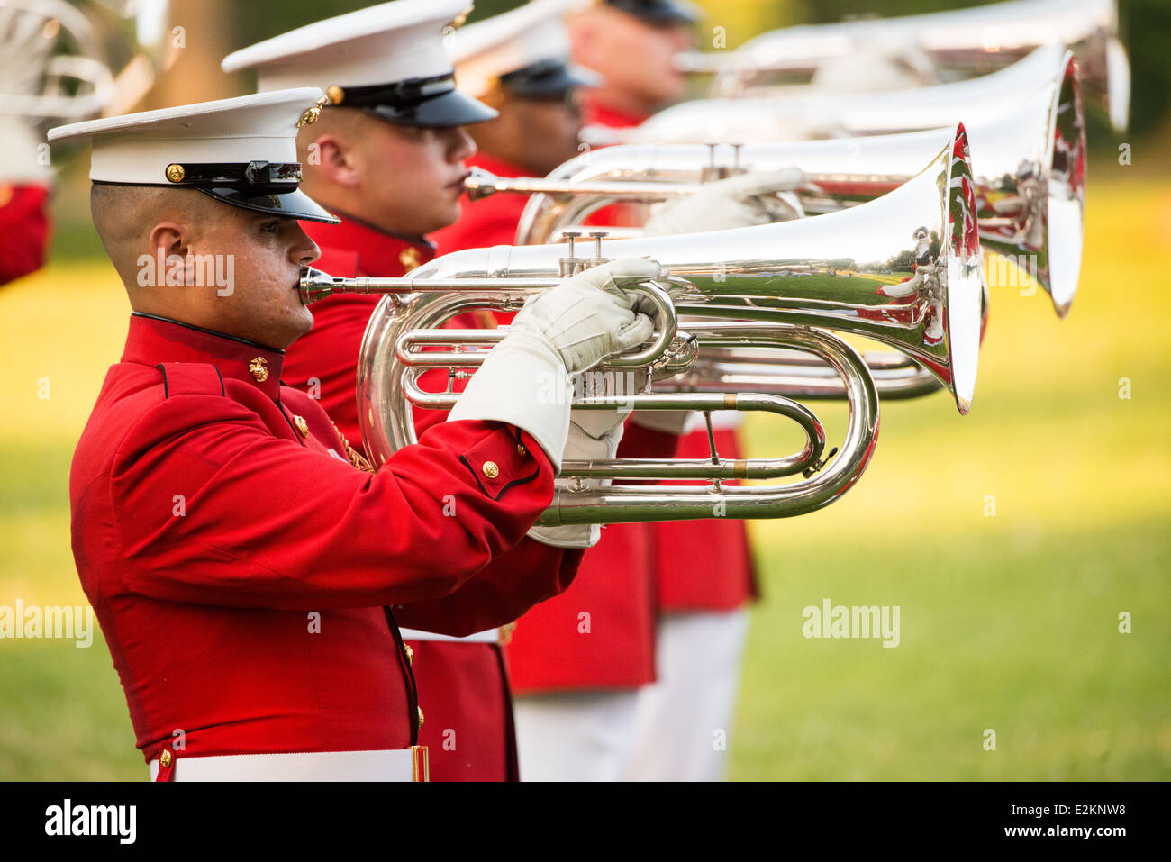 ARLINGTON, Virginia — The United States Marine Drum and Bugle Corps, known as the Commandant's Own, performs at the Sunset Parade at the Iwo Jima Memorial in Arlington, Virginia, next to Arlington National Cemetery. Stock Photo