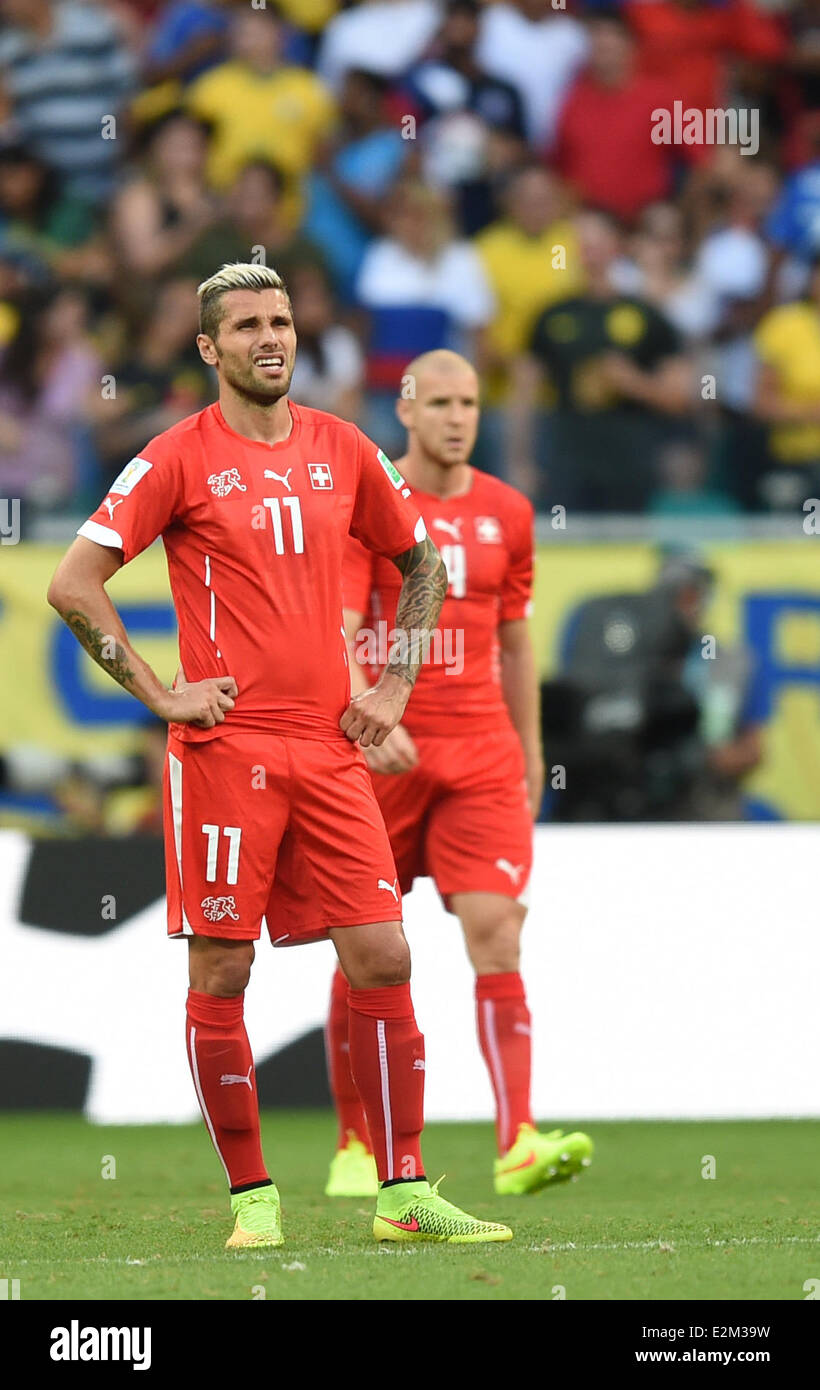 Salvador da Bahia, Brazil. 20th June, 2014.Switzerland's Valon Behrami (L) and Stephane Senderos look dejected after the 0-2 during the FIFA World Cup 2014 group E preliminary round match between Switzerland and France at the Arena Fonte Nova Stadium in Salvador da Bahia, Brazil, 20 June 2014 Credit:  dpa picture alliance/Alamy Live News Stock Photo
