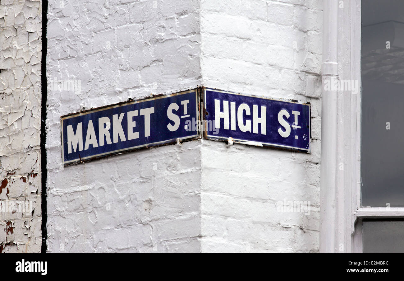 Street signs on a corner building at the junction of Market Street and High Street, Lewes, East Sussex. Stock Photo