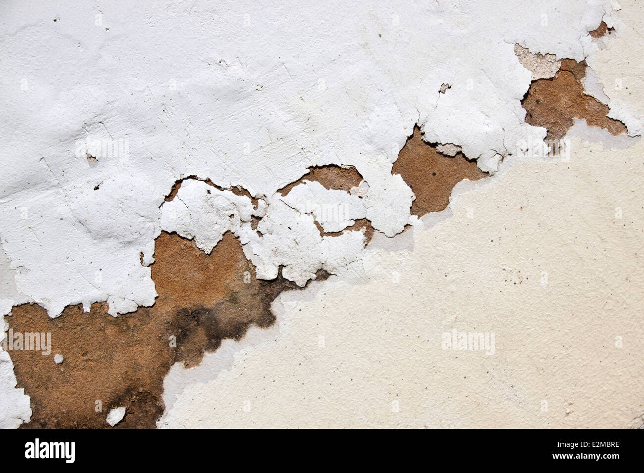 bubbling paint on exterior wall due to neglect and lack of maintenance
