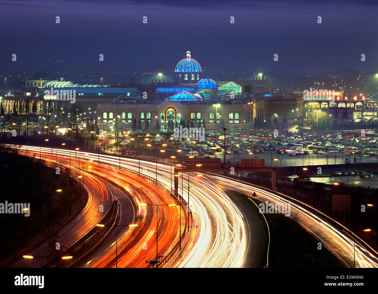 Traffic light trails on the M60 with the Trafford Centre in the