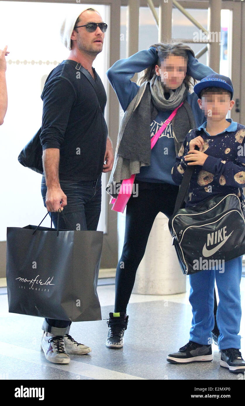 Jude Law with his daughter Iris and son Rudy arrive at Los Angeles International Airport, LAX looking tanned and relaxed after t Stock Photo
