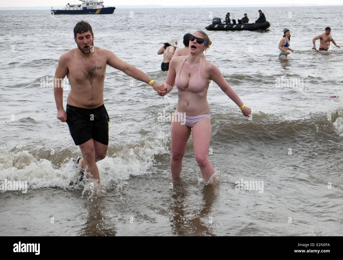 Brave New Yorkers take an Icy cold dip in the waters of Coney Island for  the annual Polar Bear swim Featuring: swimmers Where: New York City, NY,  United States When: 01 Jan