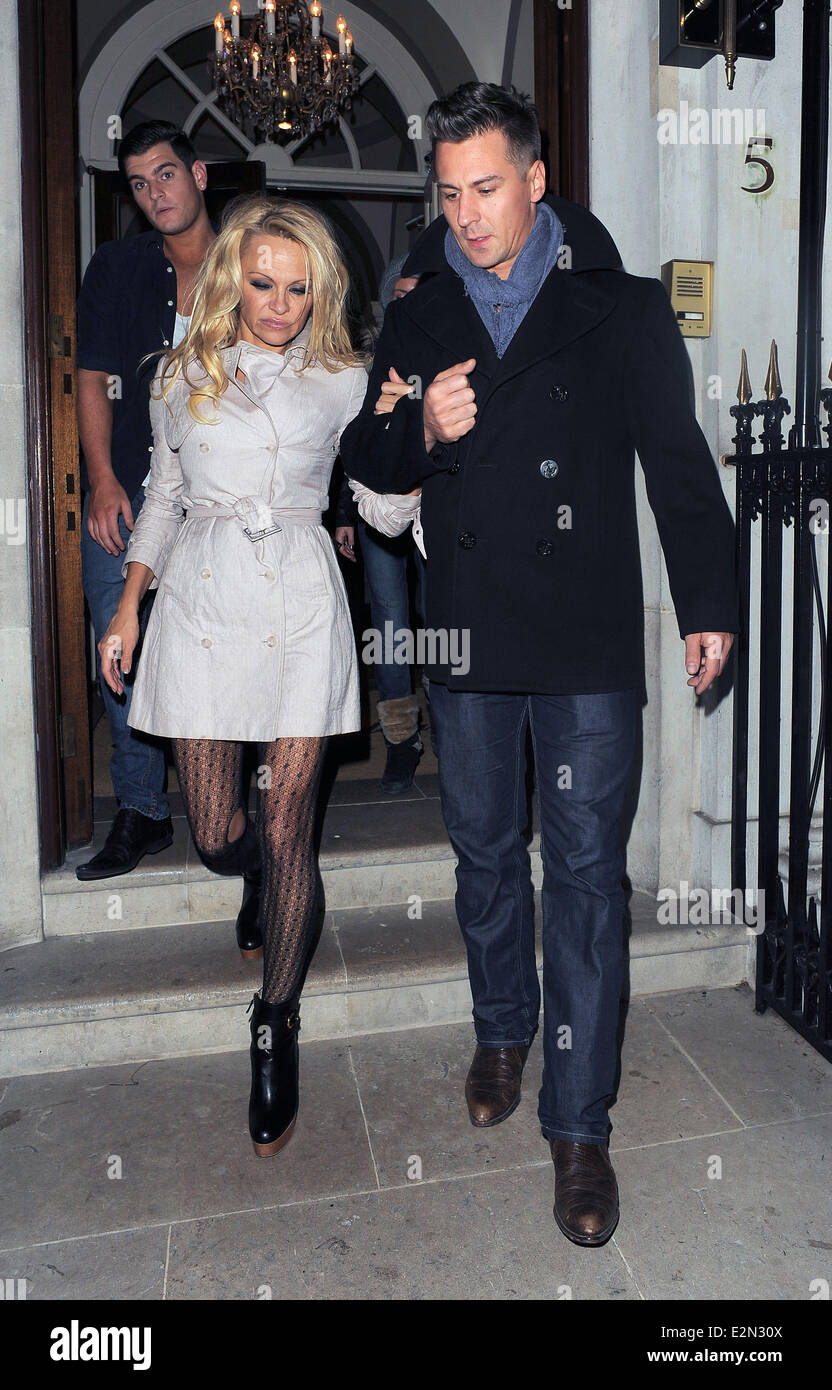 Pamela Anderson and her 'Dancing On Ice' partner Matt Evers leave Les  Ambassadeurs Club after spending around 4 hours inside the venue. Pamela  had a hole in her patterned tights on her
