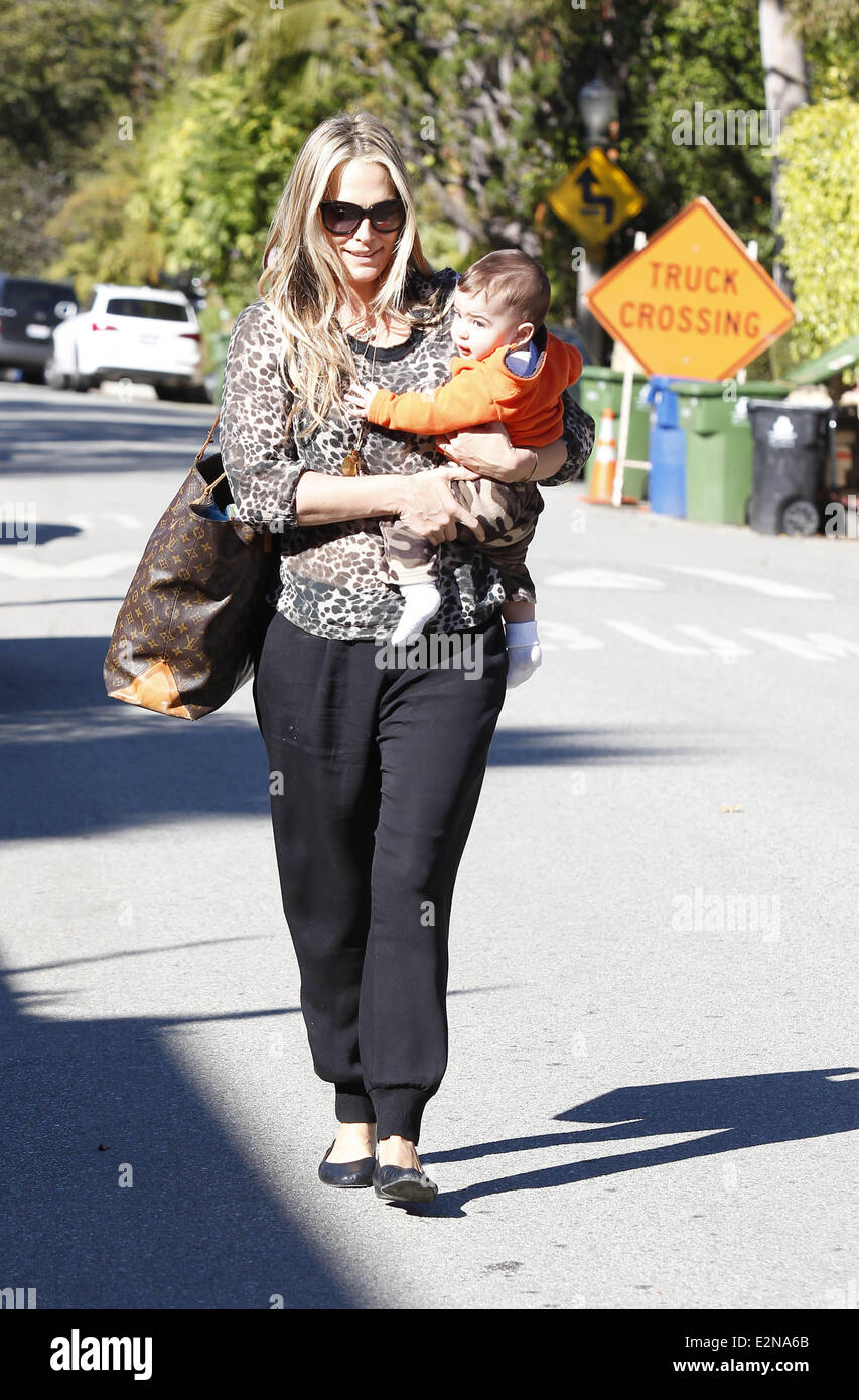 Molly Sims and her son Brooks out and about in Beverly Hills. Molly is  wearing a leopard print design top with black trousers, accompanied by a  over-sized Louis Vuitton leather bag Featuring