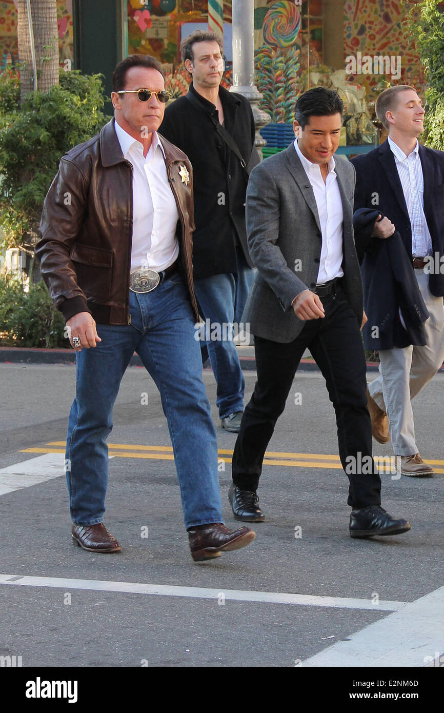 Arnold Schwarzenegger drives a Sheriff truck to The Grove to promote his new film 'The Last Stand' on entertainment news show 'Extra'  Featuring: Arnold Schwarzenegger,Mario Lopez Where: Los Angeles, California, United States When: 14 Jan 2013 Stock Photo