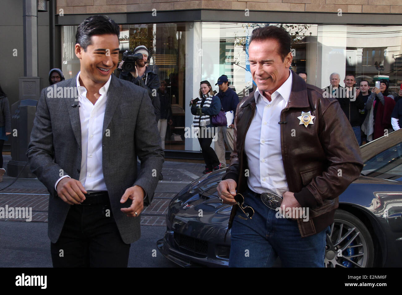 Arnold Schwarzenegger drives a Sheriff truck to The Grove to promote his new film 'The Last Stand' on entertainment news show 'Extra'  Featuring: Arnold Schwarzenegger,Mario Lopez Where: Los Angeles, California, United States When: 14 Jan 2013 Stock Photo
