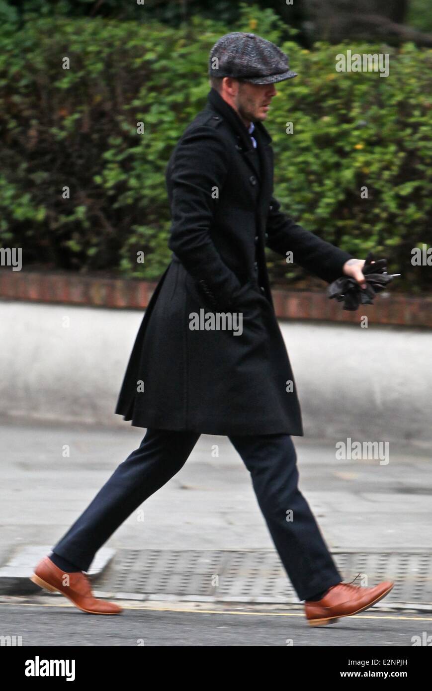 David Beckham parks his Bentley car and puts on a large winter coat as the  temperature is just above freezing in London Featuring: David Beckham  Where: London, United Kingdom When: 15 Jan