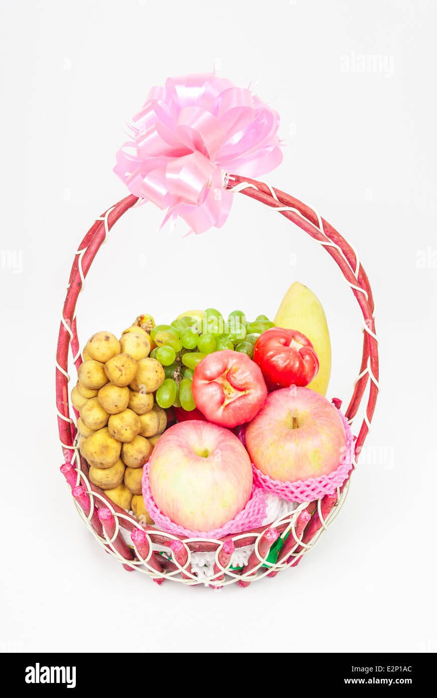 Rattan Basket of Fruits with Ribbon Bow. Stock Photo
