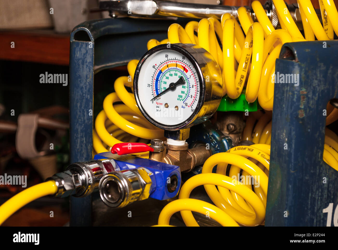 Pressure Guage on Empty Air Tank with Spiral Air Tube. Stock Photo