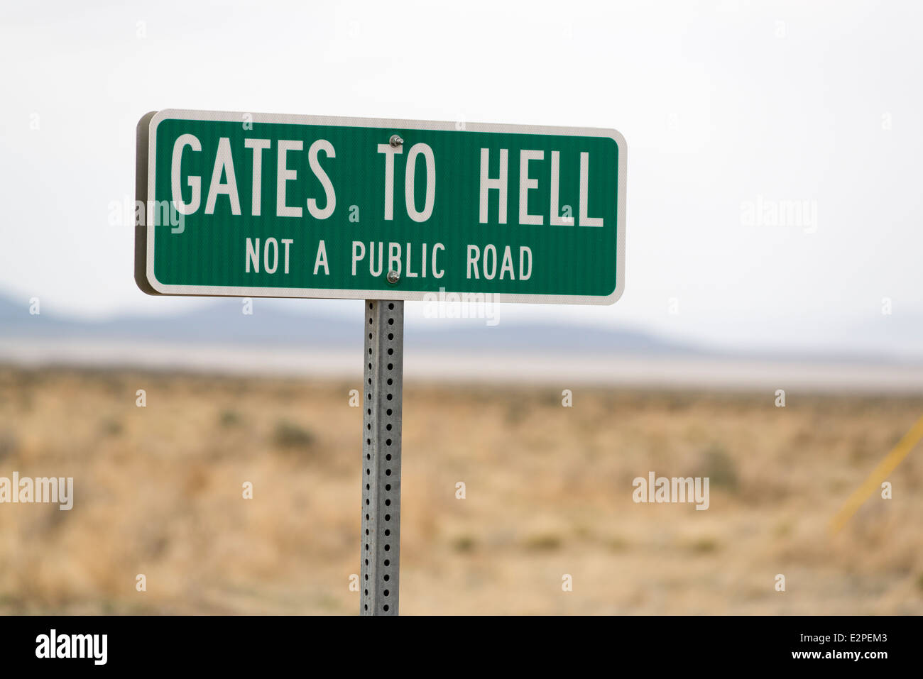 Gates To Hell sign marking a private road in the Pueblo Valley of Eastern Oregon. Stock Photo