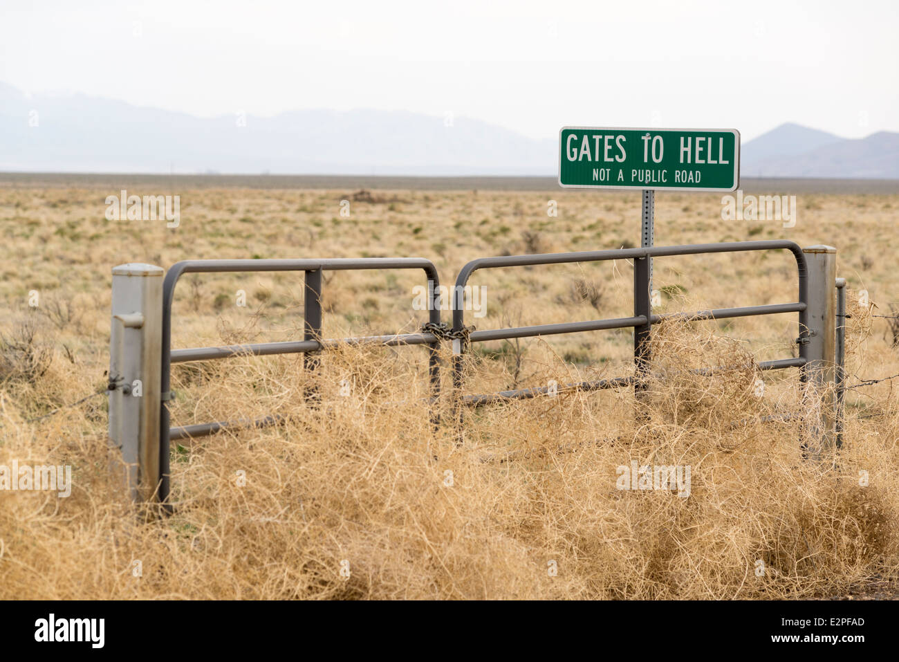 Gates To Hell sign marking a private road in the Pueblo Valley of Eastern Oregon. Stock Photo