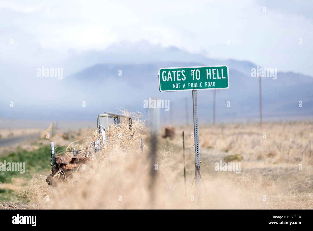 Gates To Hell sign marking a private road in the Pueblo Valley of Eastern Oregon. Stock Photo