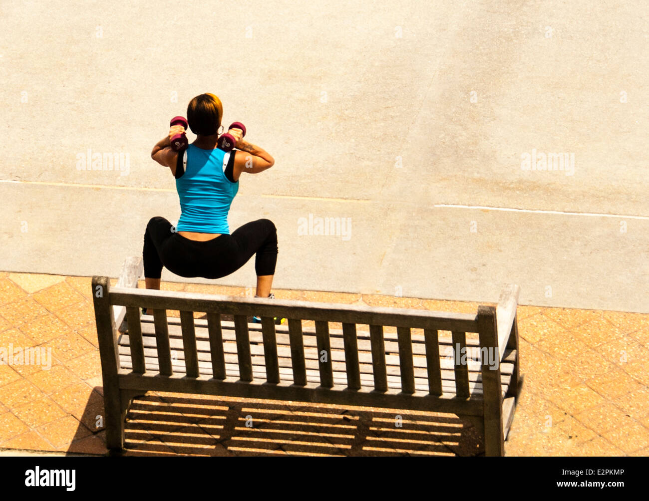 Woman Exercising Outdoors Stock Photo