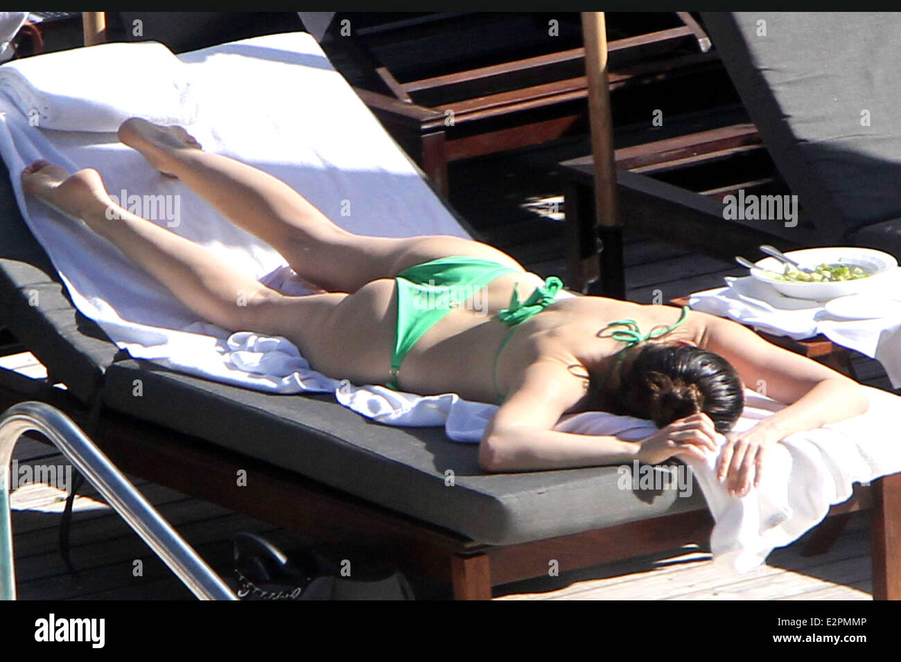 Kelly Brook shows off her stunning body as she sunbathes in a green bikini while on holiday in Miami  Featuring: Kelly Brook Where: Miami, Florida, Untied States When: 01 Feb 2013 Stock Photo