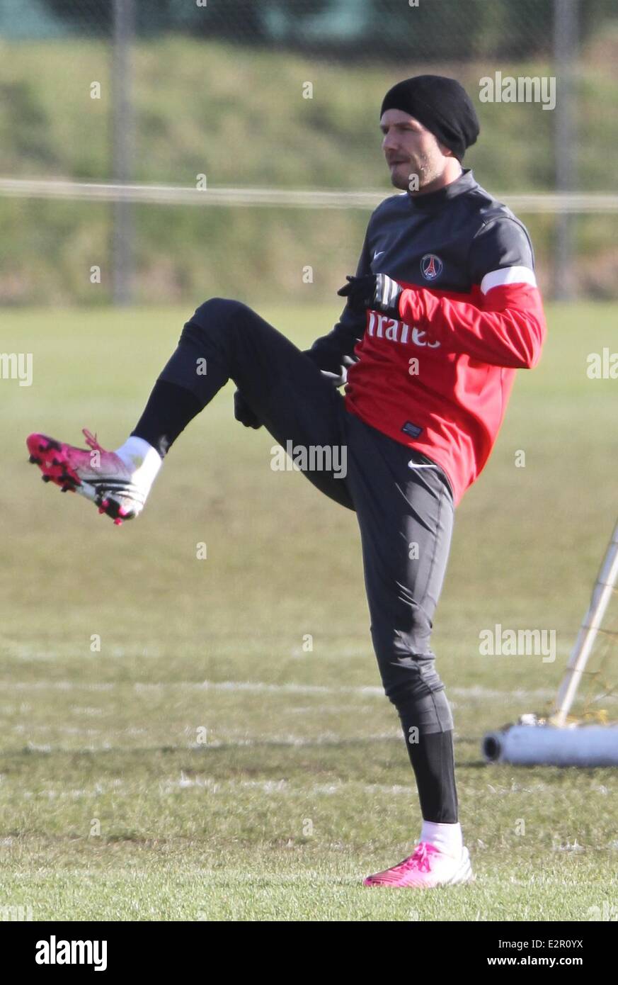 David Beckham appears in good spirits as he trains in pink Adidas football  boots and a