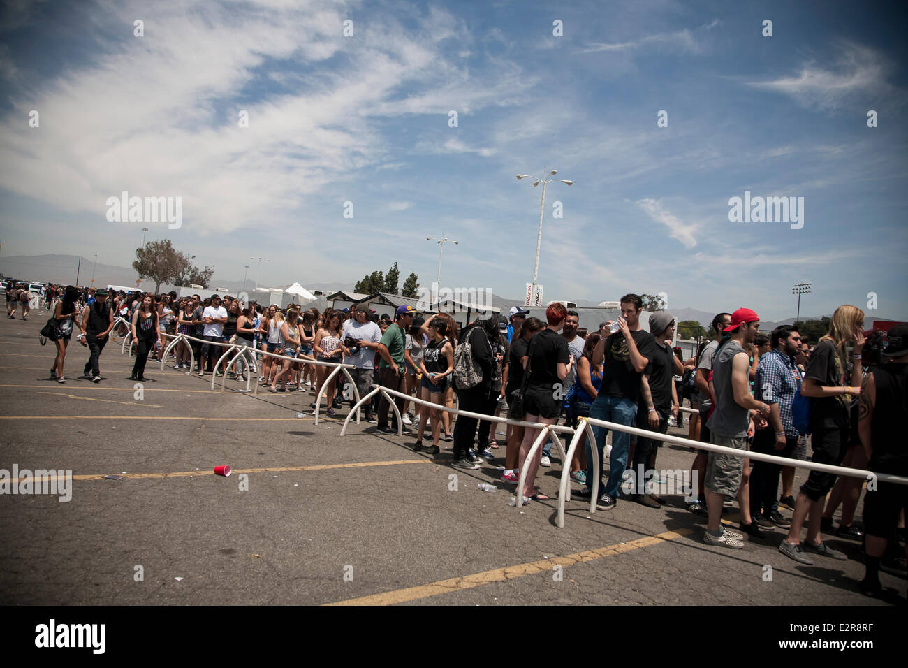 Pomona, CA, USA. 20th June, 2014. Fans stand in line at the gates of Vans Warped Tour. Thousands of young alternative music fans turned up for the U.S.’s only touring festival, at its Los Angeles-area stop in Pomona, California. The festival tour continues tomorrow in Mountain View, CA, USA and finishes in August in Denver, CO, USA. Credit:  Andie Mills/Alamy Live News Stock Photo