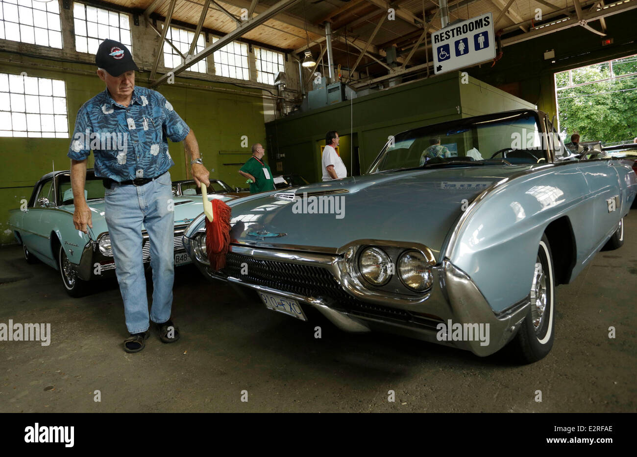Vancouver, Canada. 20th June, 2014. A collector cleans his car at the Collector Car Show in Vancouver, Canada, June 20, 2014. The second annual Collector Car Show and Auction showcases over 700 vintage vehicles including nearly 150 classic rides for auction. Credit:  Liang Sen/Xinhua/Alamy Live News Stock Photo