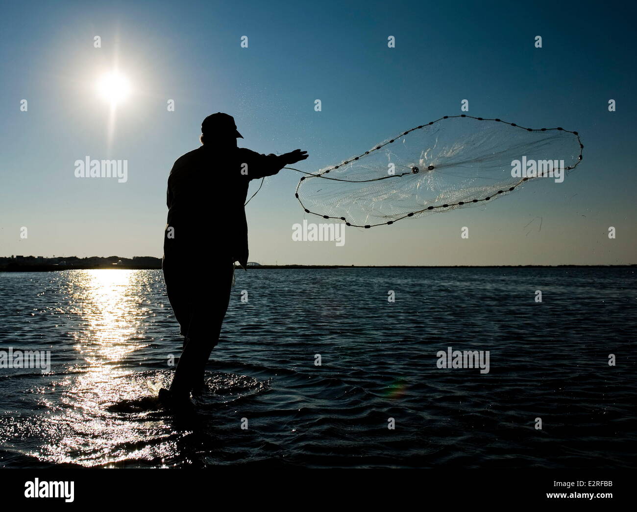 Port Aransas, Texas, USA. 18th Aug, 2013. JOE ALVARADO throws a fishing