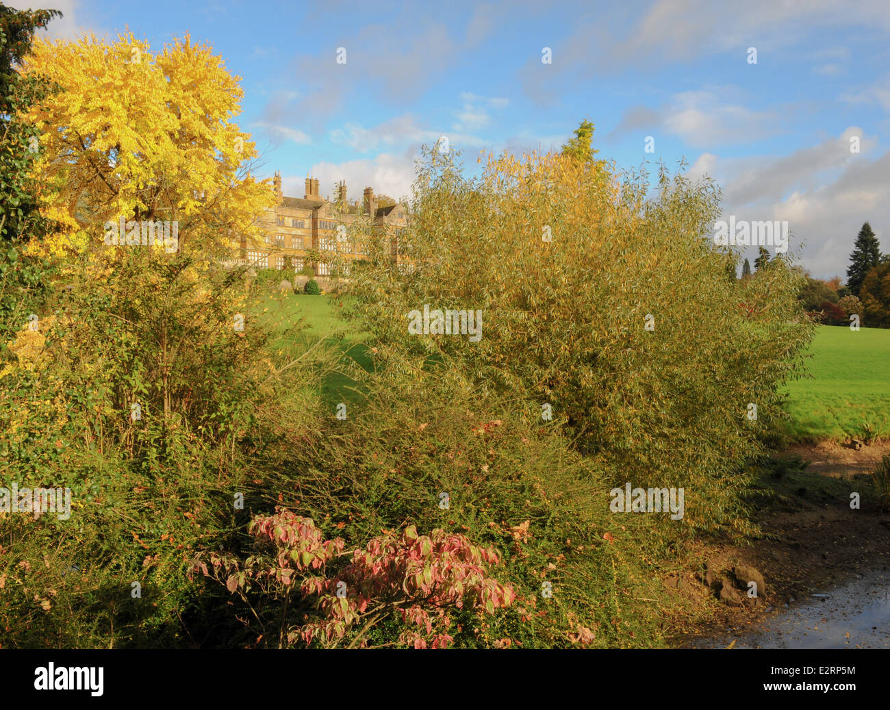 Manor House in the Grounds of Batsford Arboretum Surrounded by Autumn Colour next to the historic market town of Moreton-in-Marsh in The Cotswolds. Stock Photo
