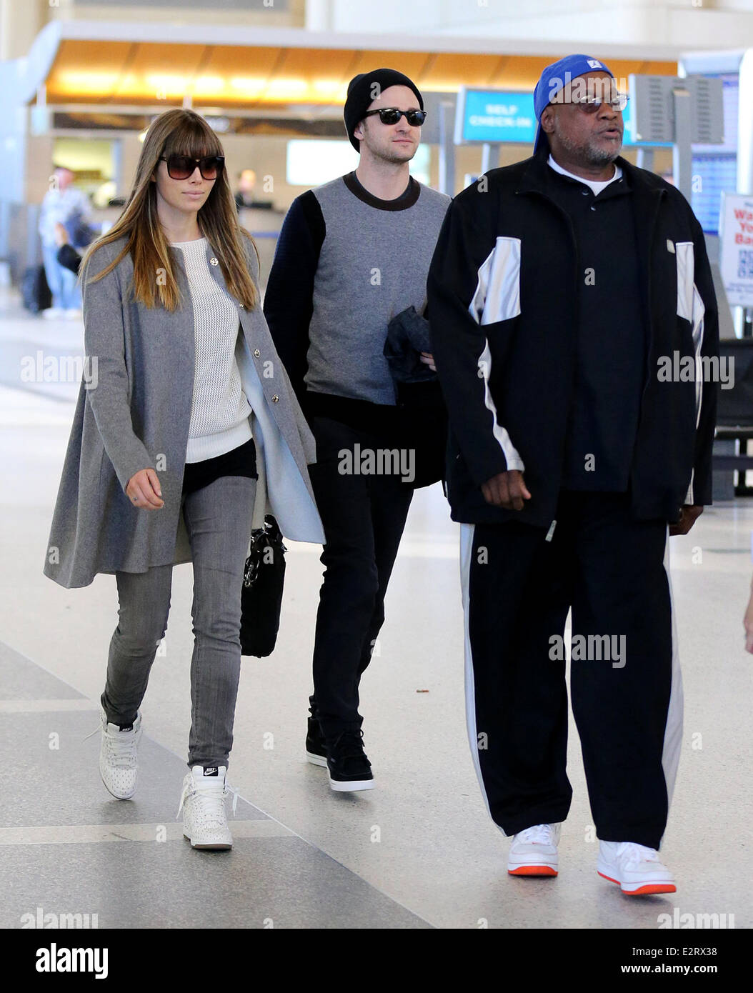 Justin Timberlake and wife Jessica Biel arrive at LAX airport together with a bodyguard Featuring: Jessica Biel,Justin Timberlake,Bodyguard Where: Los Angeles, California, United States When: 16 Feb 2013 Stock Photo